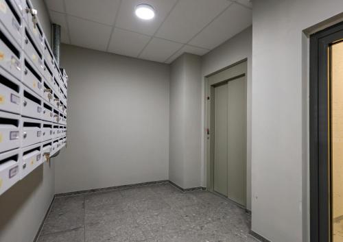 a hallway of an office with white walls and a door at Center apartments - Hekla in Reykjavík