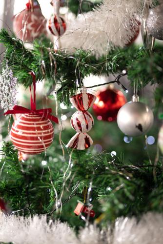 a close up of a christmas tree with ornaments at Apartment Viksa with Jacuzzi in Zagreb