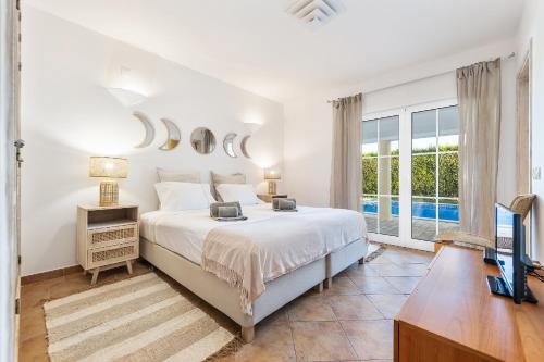 Ένα ή περισσότερα κρεβάτια σε δωμάτιο στο Villa Dome by OCvillas