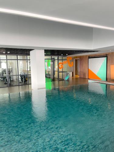 a large pool of water in a building at Atria SOFO Suites By Stay In in Petaling Jaya