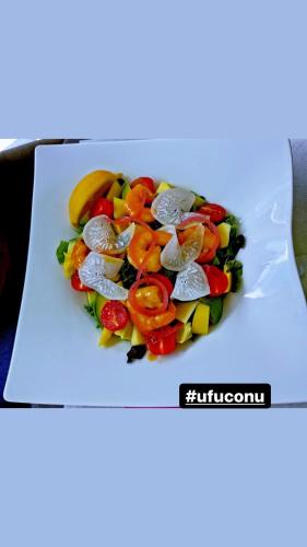 a pile of vegetables on a white plate at Cantu di Fiumu in Zonza