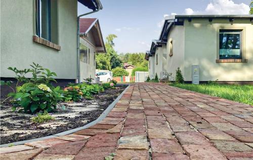 a brick driveway in front of a house at Beautiful Home In Wilcze With Wifi in Wilcze