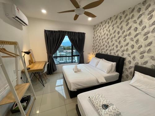 a hotel room with two beds and a window at Ipoh Waterpark Manhattan Premium Suites by IWH Suites in Ipoh