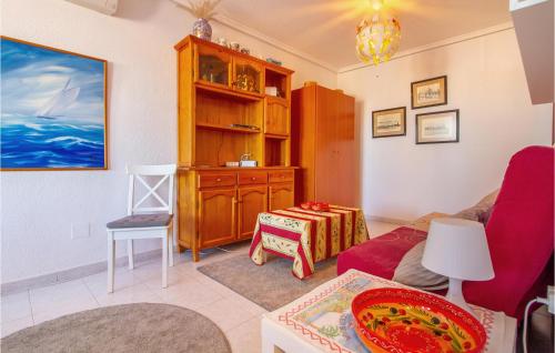 a living room with a couch and a table at Nice Apartment In Torrevieja With Wifi in Torrevieja