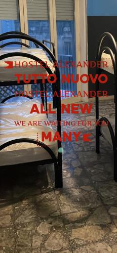 a bench with a sign that reads those turned into two humans istgsenalsenalsenal at Alexander hostel in Naples