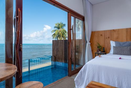 Giường trong phòng chung tại Villa Pantai Boutique Hotel Maragogi
