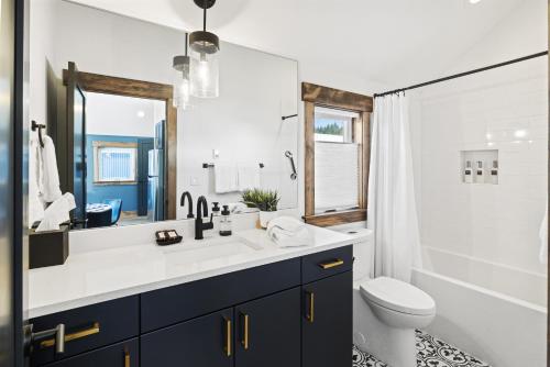 a bathroom with a sink and a toilet and a mirror at Suncadia Resort Luxury Home Next To Nelson Farm in Cle Elum