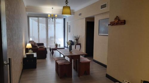 a living room with a table and a couch at Quinta Manuela in Mendoza