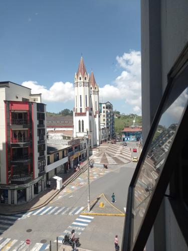 a view of a city street with a church at Apartamento thecanarys in Santa Rosa de Cabal