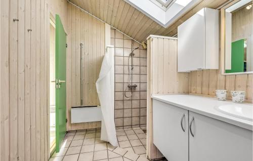 a bathroom with a shower and a sink at Awesome Home In Otterup With Kitchen in Otterup