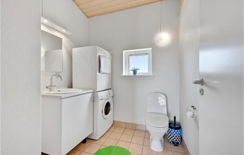 a white bathroom with a sink and a toilet at Stunning Home In Faaborg With Wifi in Åstrup