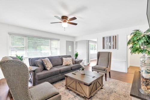 a living room with a couch and chairs at Cozy 4bedroom Bungalow in Davidson Sleeps 10 in Davidson
