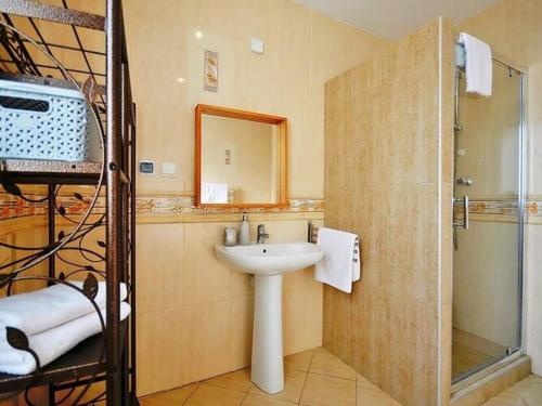 a bathroom with a sink and a shower at Apartment with a terrace, very close to the beach, Ustronie Morskie in Ustronie Morskie