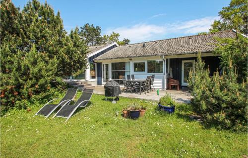 a house with a deck and a patio at Lovely Home In Samsø With Wifi in Onsbjerg
