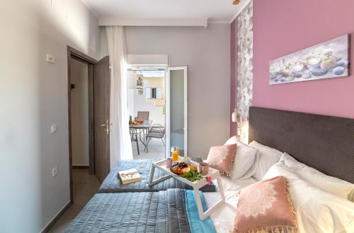 A bed or beds in a room at Chania Design Suites