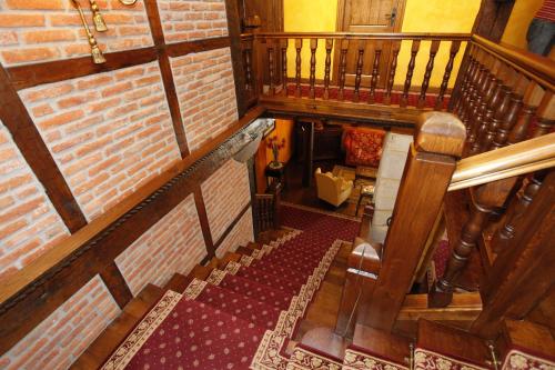 an overhead view of a staircase in a building at La Casa del Organista in Santillana del Mar