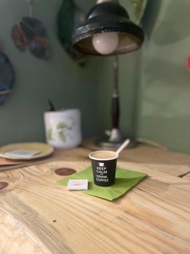 a cup of coffee sitting on top of a table at La Cascina di Bea in Torre Boldone