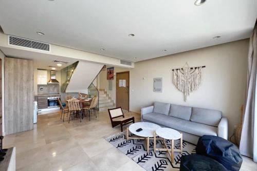 A seating area at Spectacular & Soaring 2 BDR w Private Rooftop Jacuzzi & Beach Access