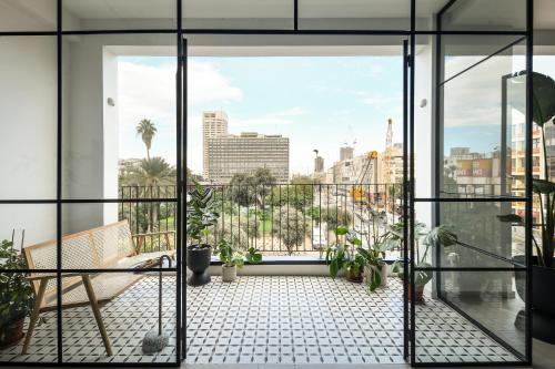 an open balcony with a view of the city at Picturesque 3BR Apt w Panoramic Views in Tel Aviv by Sea N' Rent in Tel Aviv