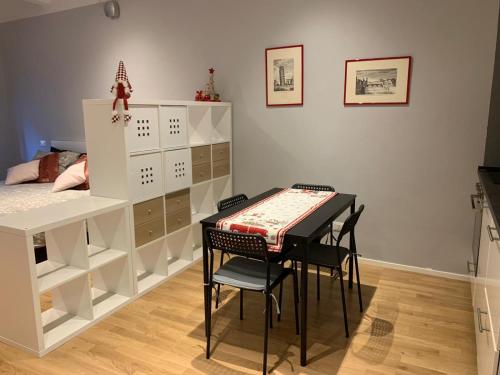 a bedroom with a desk and a table and a bed at LA PICCOLA MAGIA in Pisa