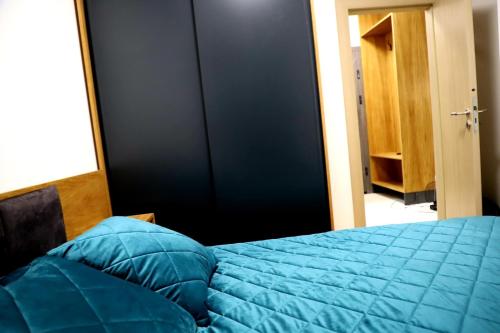 A bed or beds in a room at Apartman Ana, Vila Katalina 2