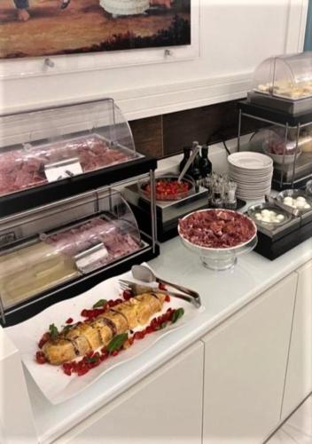 a kitchen with some food on a counter at Palazzo Firenze in Naples