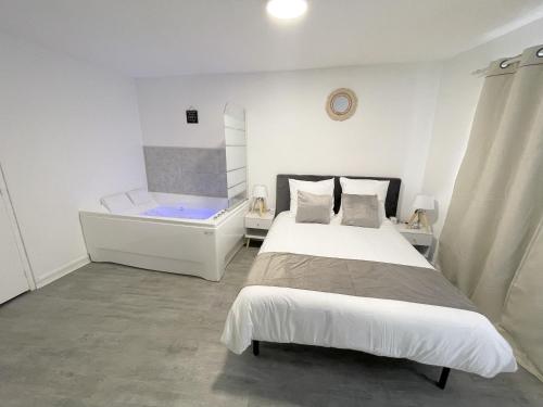 Postelja oz. postelje v sobi nastanitve Le Corbusier - Cosy & SPA