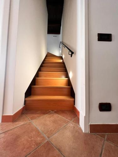 a staircase in a building with wooden floors at Isabel’s house in Vietri sul Mare
