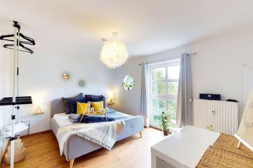 a living room with a bed and a window at Wohlfühl-Wohnen in Düren in Düren - Eifel