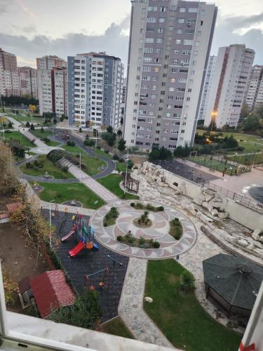 a view of a park in a city with tall buildings at lovely 2 bedrooms apartment with full furniture in Beylikduzu