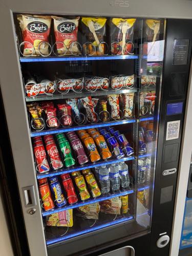 a vending machine filled with lots of drinks and soda at Hotel Class'Eco Carcassonne in Carcassonne