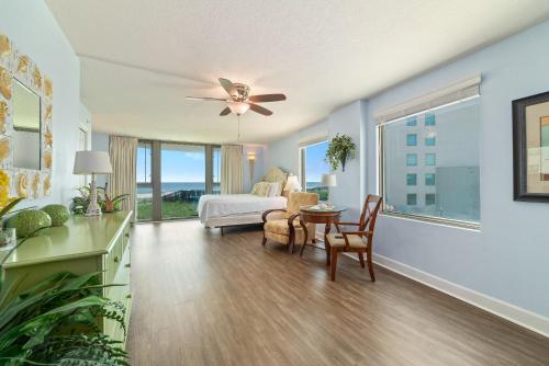 a living room with a bed and a table at Perdido Towers East 106 in Perdido Key