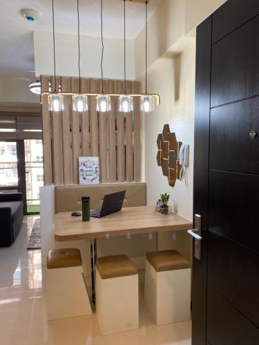 an office with a desk with a laptop on it at Le 10 The Radiance Manila Bay in Manila
