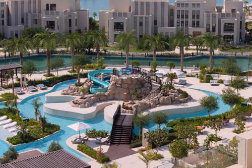 an aerial view of a resort with a water park at Jumeirah Gulf of Bahrain Resort and Spa in Manama