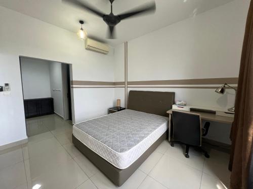 a bedroom with a bed and a desk and a desk at Paloma in Subang Jaya