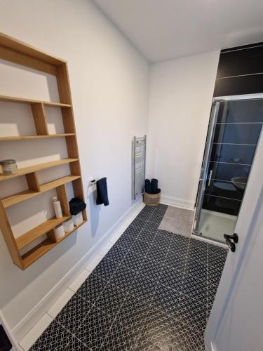 a bathroom with a walk in shower and a glass door at The Gate House, Kilmullen in Portarlington
