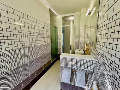 a bathroom with a sink and a mirror at Eden sul Lago di Como in Nesso