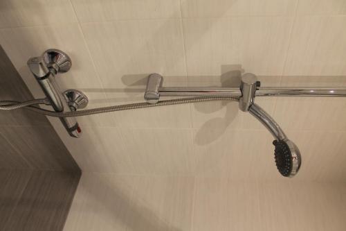 a shower head on a wall in a bathroom at Pensión Manoli in Bilbao