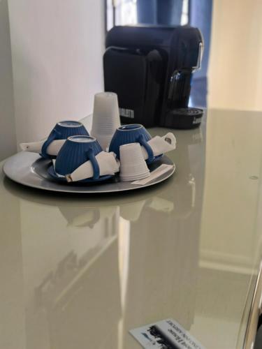 a plate with hats and napkins on a table at Fiumicino Inn Airport in Fiumicino