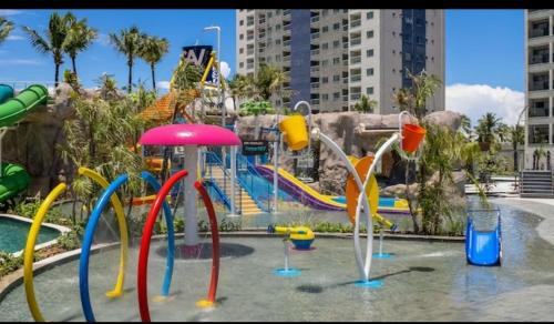 a water park with a playground with a water slide at Salinas Premiun Resort Vista Mar ap1604 in Salinópolis