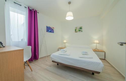 Letto o letti in una camera di B21 - Oliveira Cozy Flat