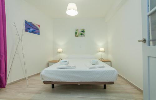 เตียงในห้องที่ B21 - Oliveira Cozy Flat