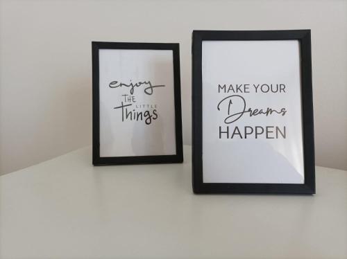 two framed pictures sitting on a wall at Sweet Home Annalisa in Ortona