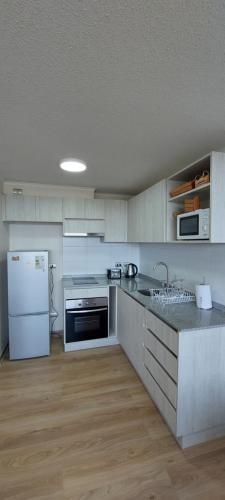 Kuchyň nebo kuchyňský kout v ubytování Ainil Apartment