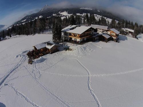 an aerial view of a ski lodge in the snow at Tyroler Hof in Grän