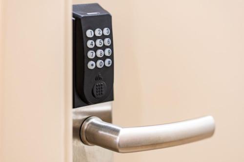 a close up of a door with a remote control at Suncanarias Hotel Adeje Plaza in Adeje