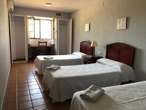 Postel nebo postele na pokoji v ubytování Apartamentos Atalayas Extremadura