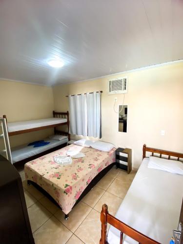 a bedroom with two beds in a room at Pousada Village Rio Centro in Rio de Janeiro