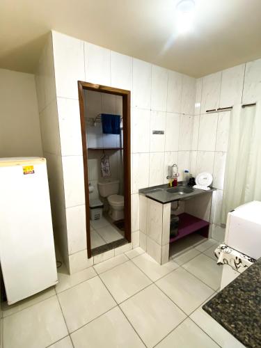 a small bathroom with a sink and a toilet at Pousada Village Rio Centro in Rio de Janeiro
