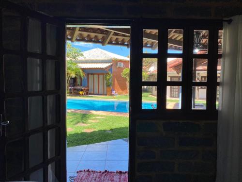 Kolam renang di atau dekat dengan Chalé com Piscina em Guaratiba- Prado